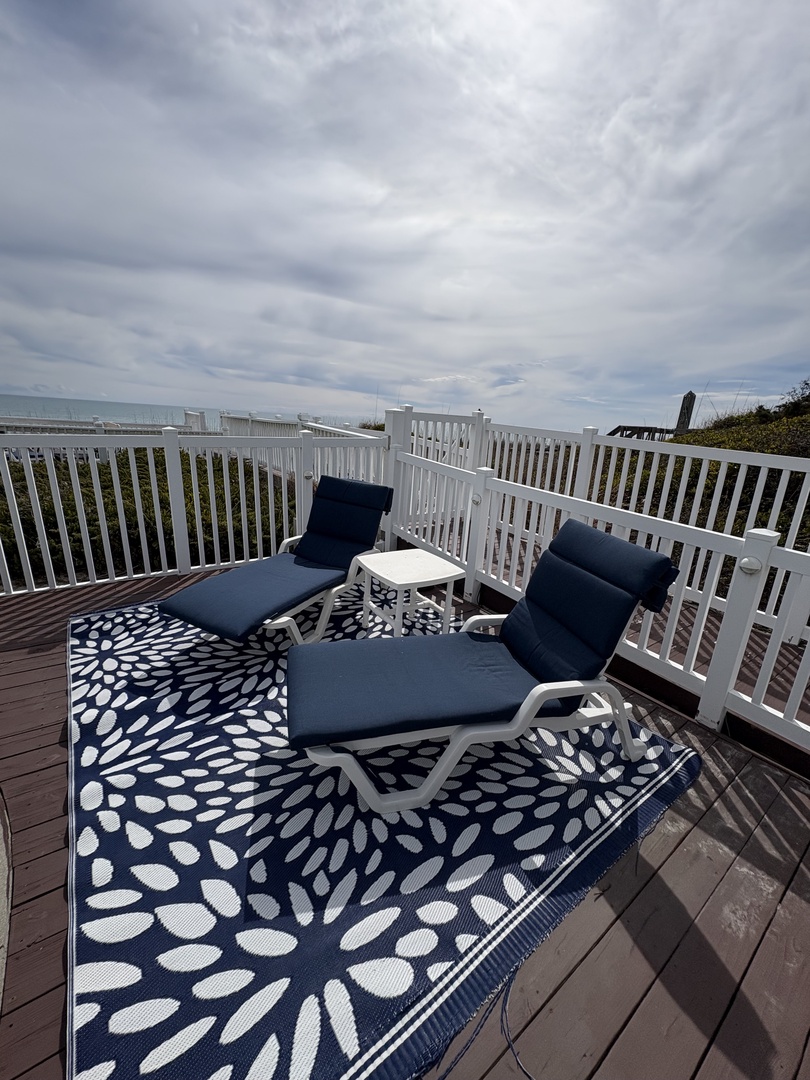 Step onto your private deck and sink into comfortable seating while enjoying the stylish outdoor rug beneath your feet.