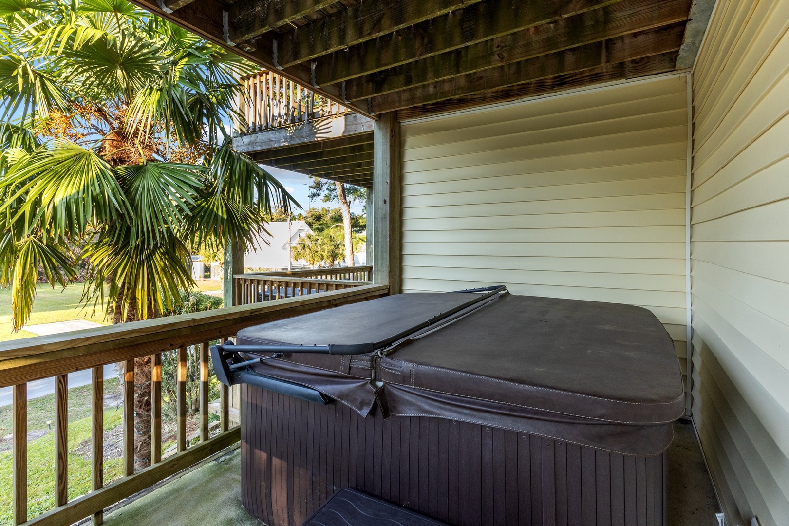 Unwind in your private hot tub while tropical palms sway nearby, creating the perfect retreat for relaxation.