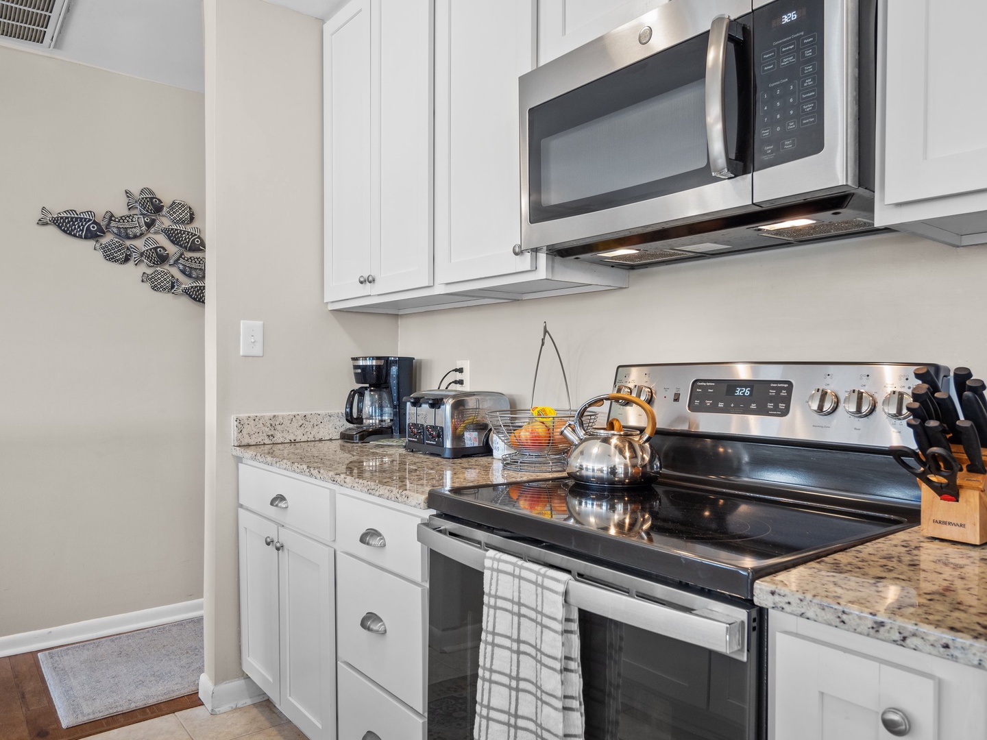 Your fully equipped kitchen awaits with granite counters, stainless appliances, and everything needed to prepare memorable meals during your stay.