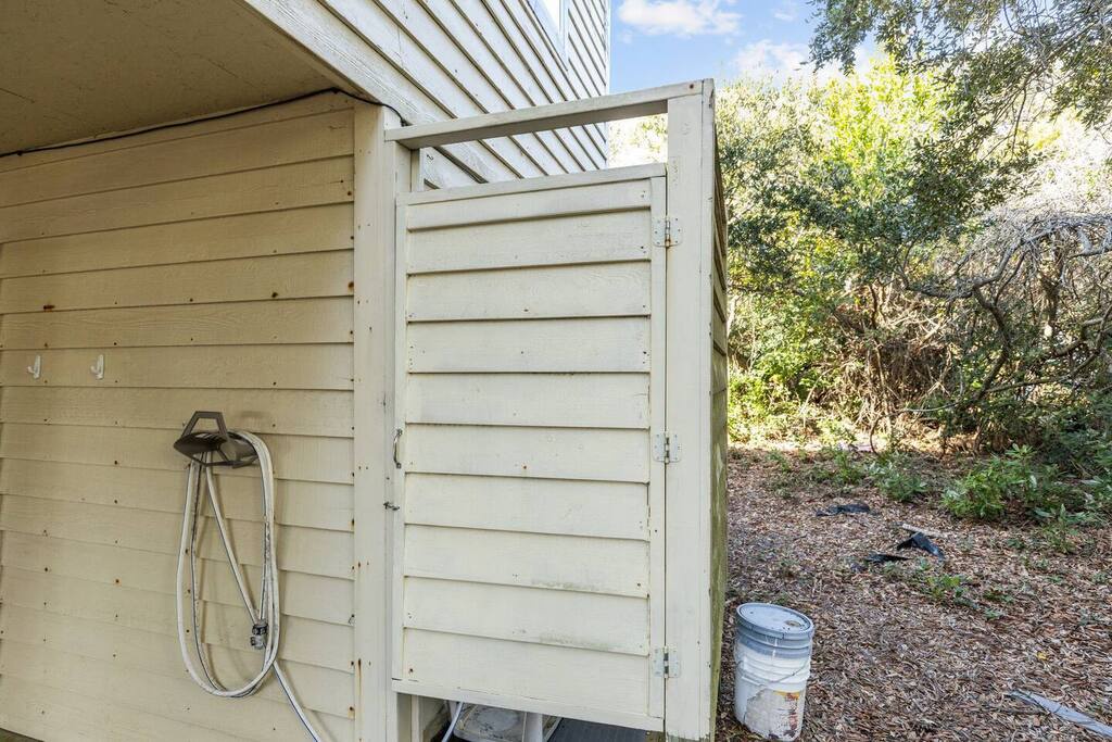 Rinse off after outdoor adventures in your private outdoor shower, surrounded by natural greenery and peaceful privacy.