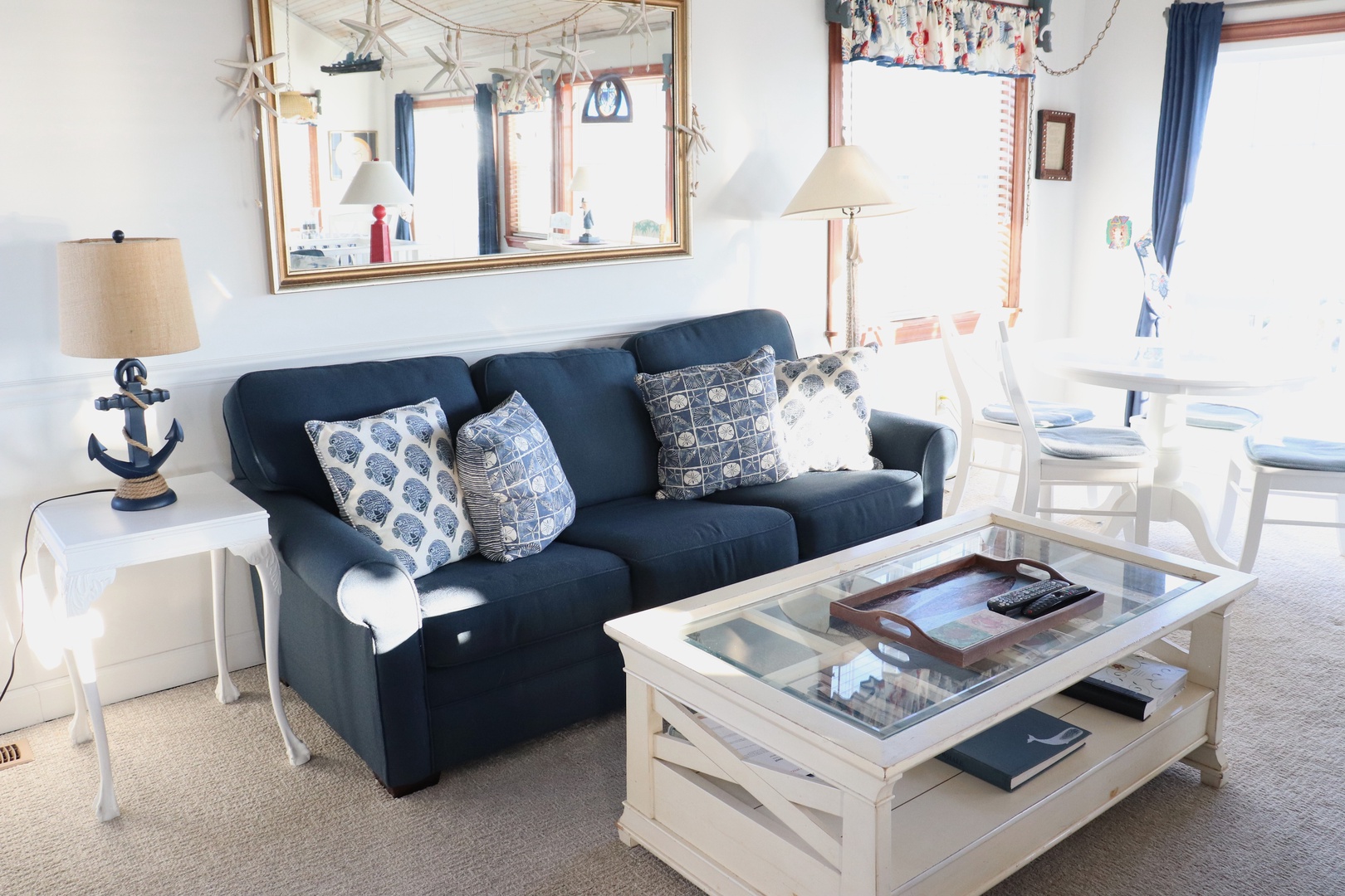 Relax in your coastal-themed living space with nautical touches, comfy seating, and charming seaside decor that makes you feel right at home.