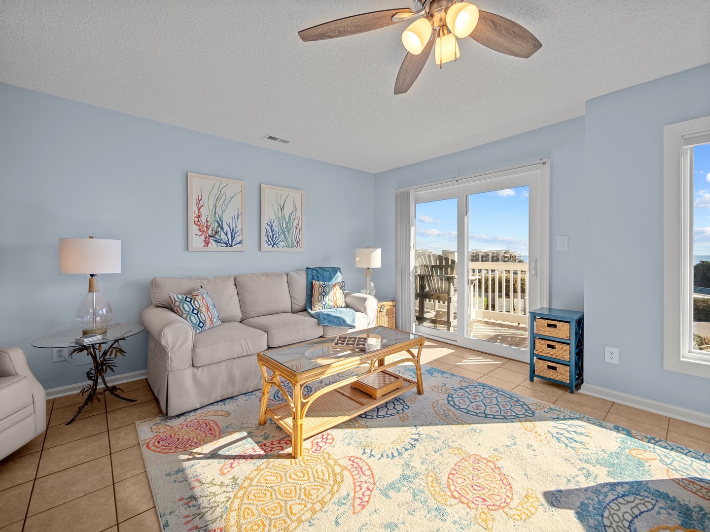 Unwind in your bright living room with coastal charm, soft seating, and sliding doors that open to your private balcony.