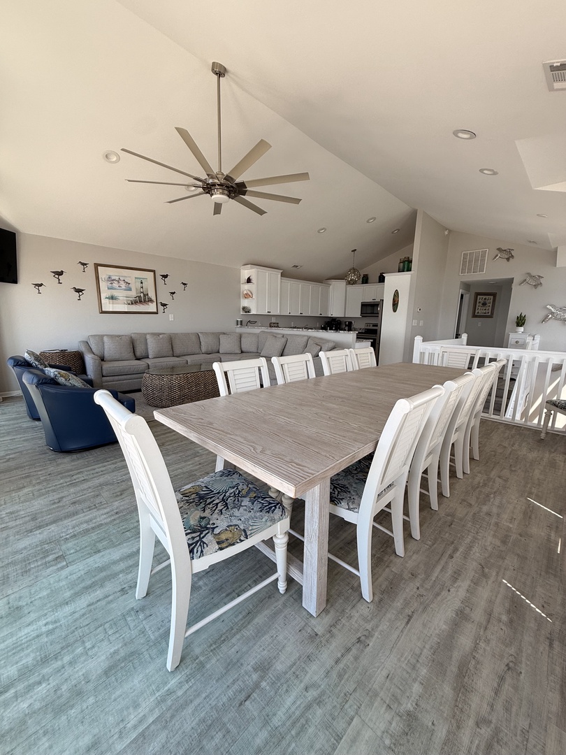 A bright, coastal-inspired living space invites you to unwind with soft neutral tones, comfortable seating, and breezy white accents that create a serene, beachy retreat atmosphere.