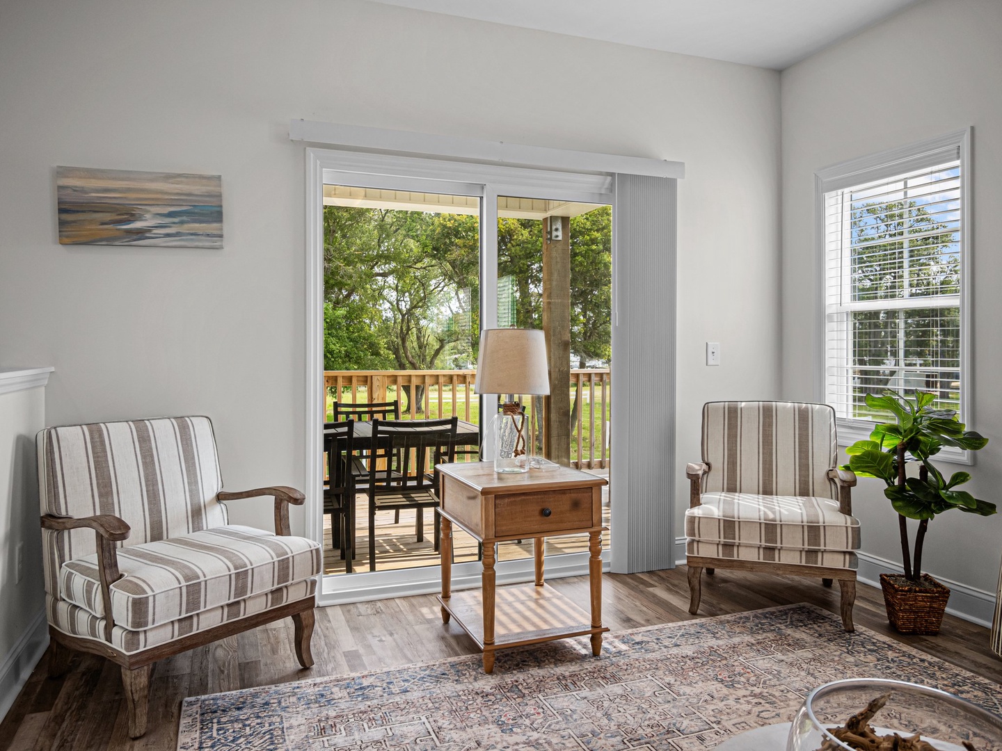 Relax in your elegantly furnished sitting area with French doors opening to your private balcony overlooking lush greenery.