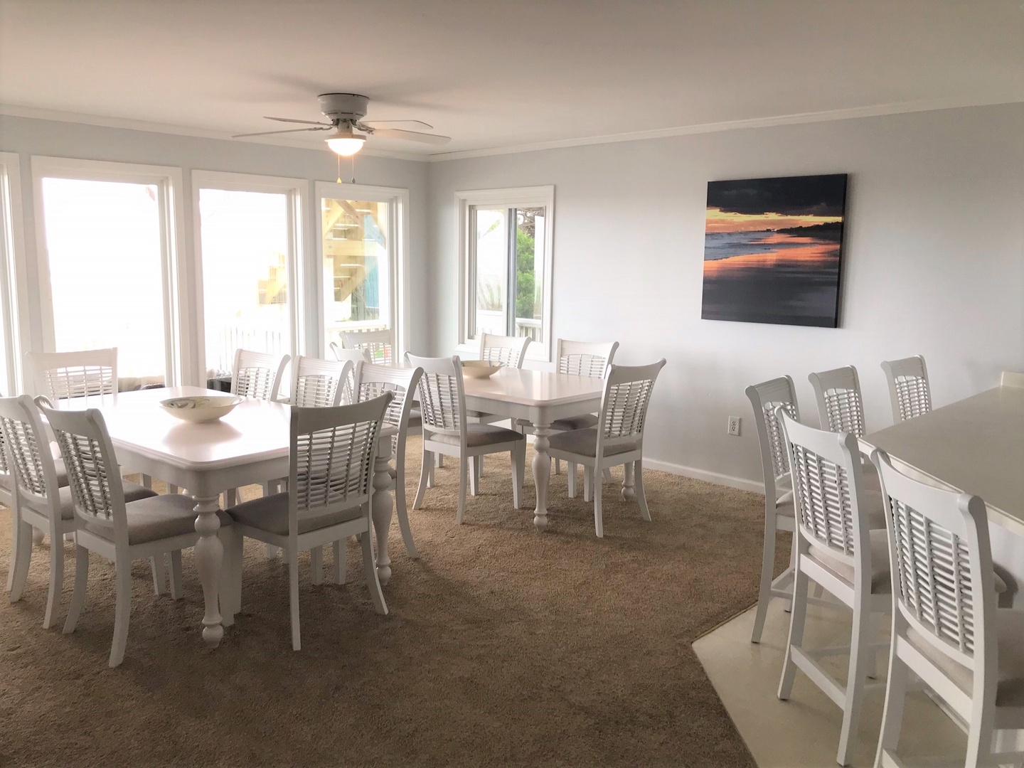 Gather your group around these elegant dining tables where natural light flows through large windows, creating the perfect setting for memorable meals together.
