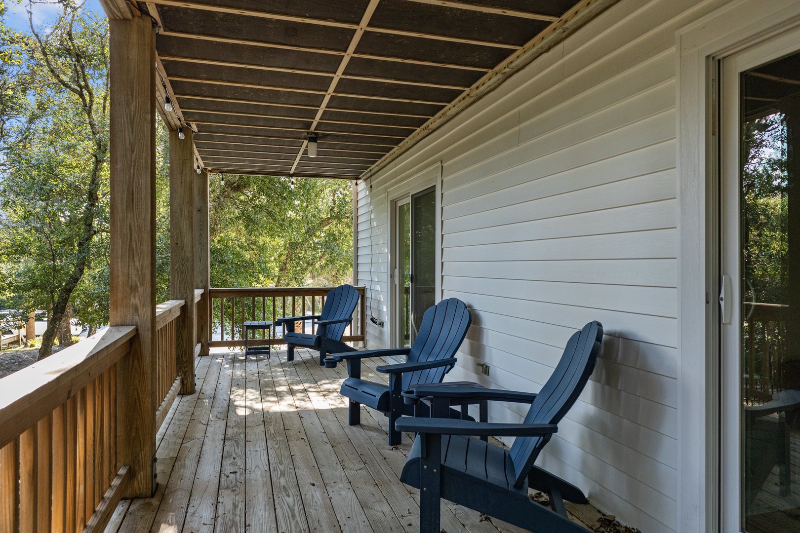 Unwind on your private covered deck with comfortable Adirondack chairs, where morning coffee tastes better surrounded by peaceful trees.