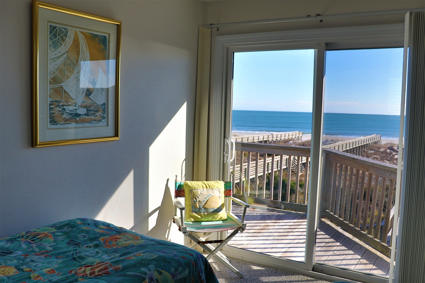 Wake up to breathtaking ocean views from your beachfront bedroom, where morning light streams through sliding doors onto your private balcony overlooking pristine sands.