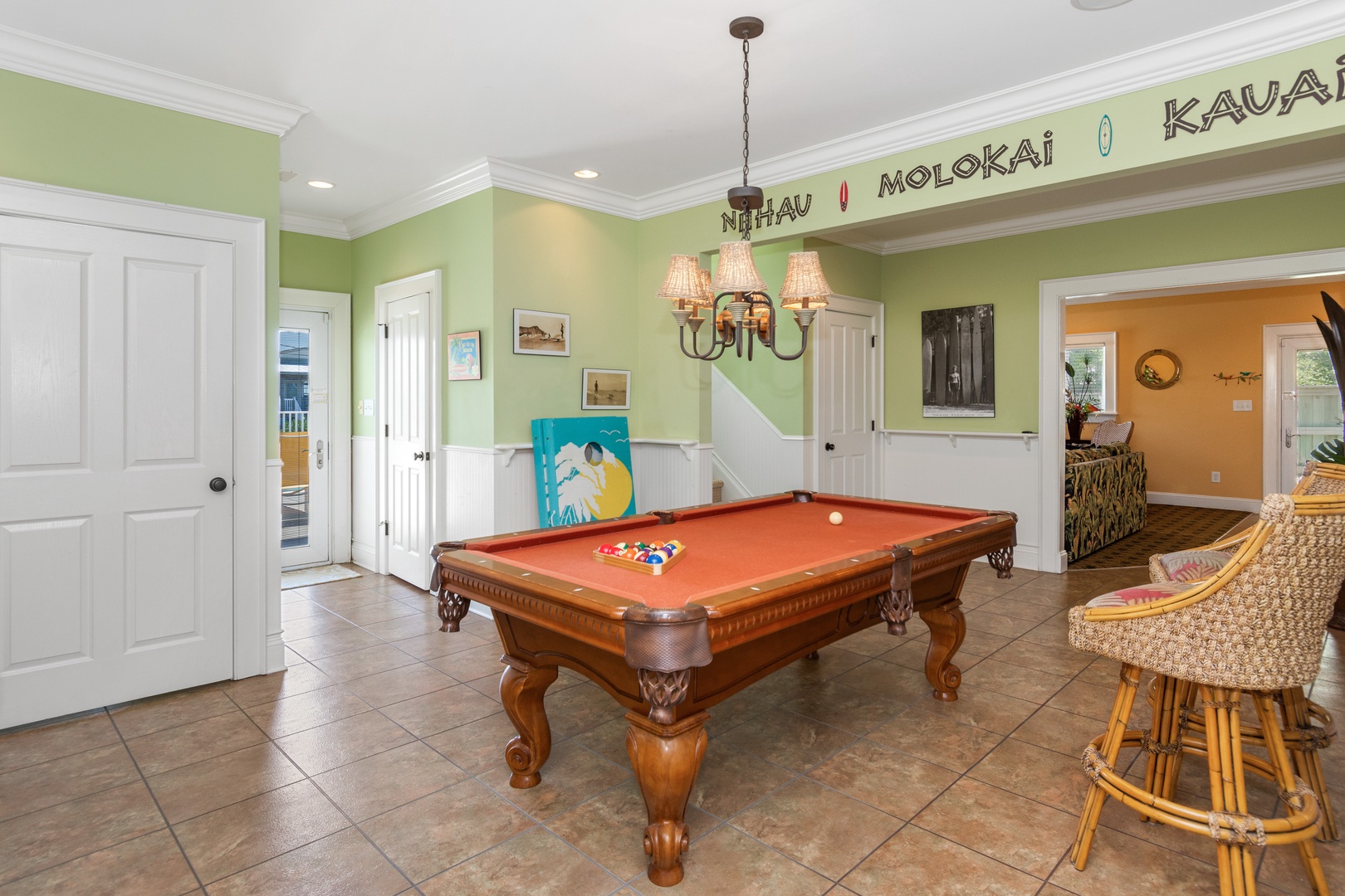 Challenge friends to a game of pool in your spacious Hawaiian-themed game room, complete with tropical decor and comfortable seating.