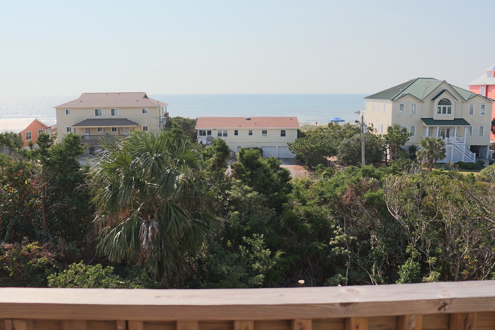 Coastal neighborhood with beach houses and ocean views creating a peaceful seaside community setting.
