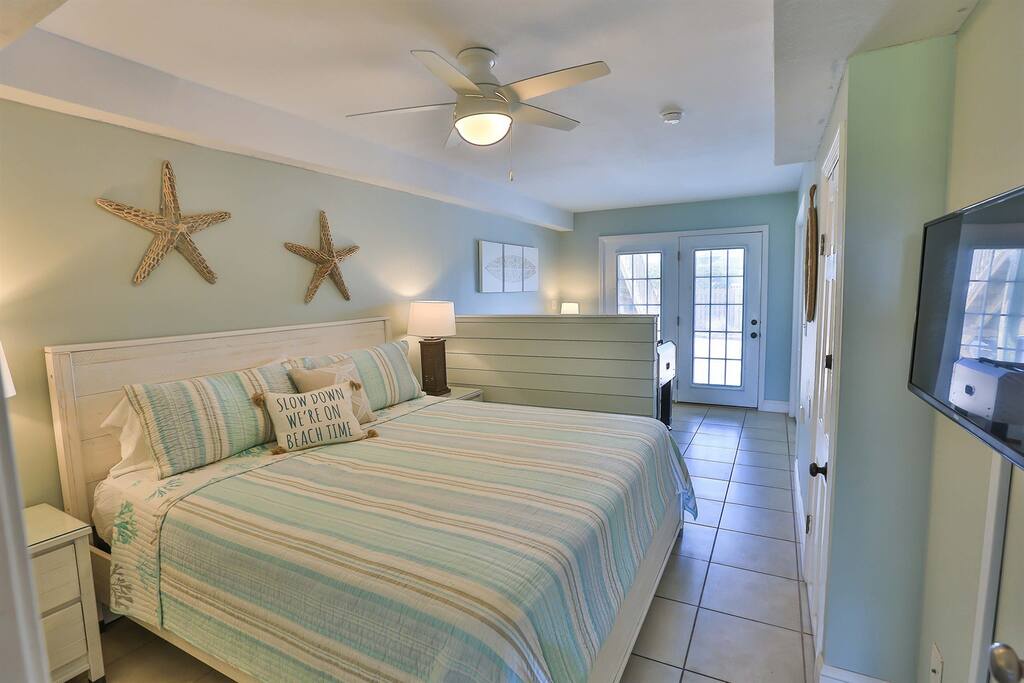 Drift off to coastal dreams in your serene beach-themed bedroom, complete with soft sea-glass hues and starfish decor that whisper of ocean adventures.