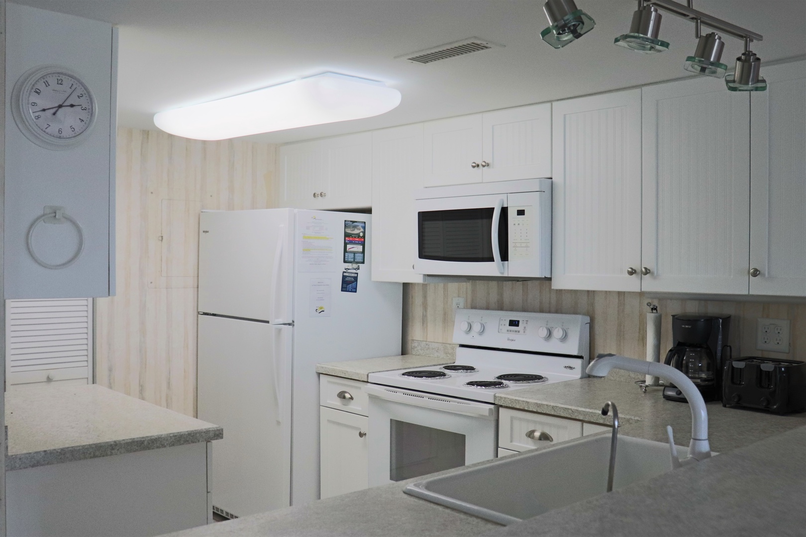 Your fully equipped kitchen features modern appliances and granite counters, perfect for preparing meals during your stay.