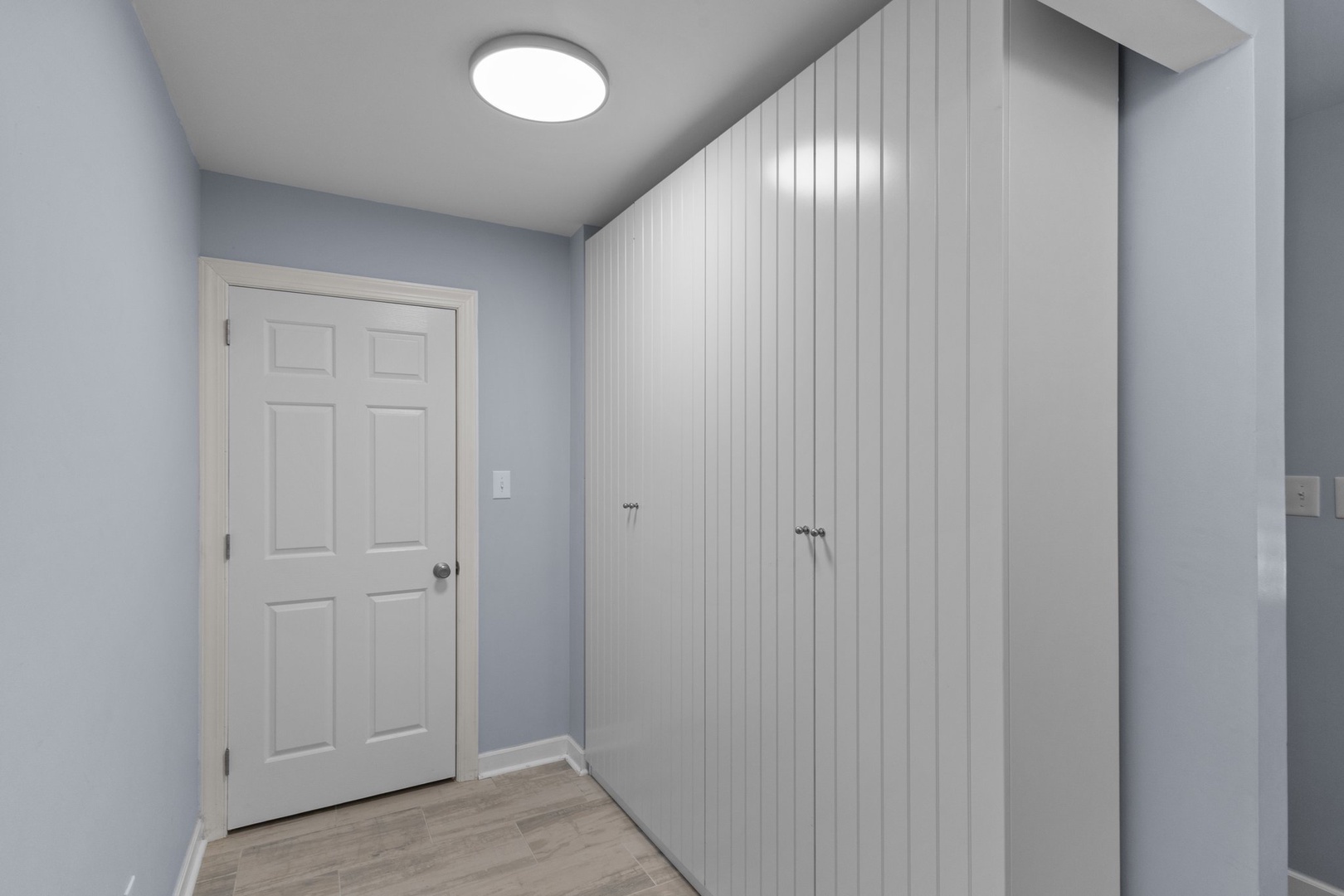 Store your belongings in this bright, organized entry area featuring ample closet space and clean finishes.