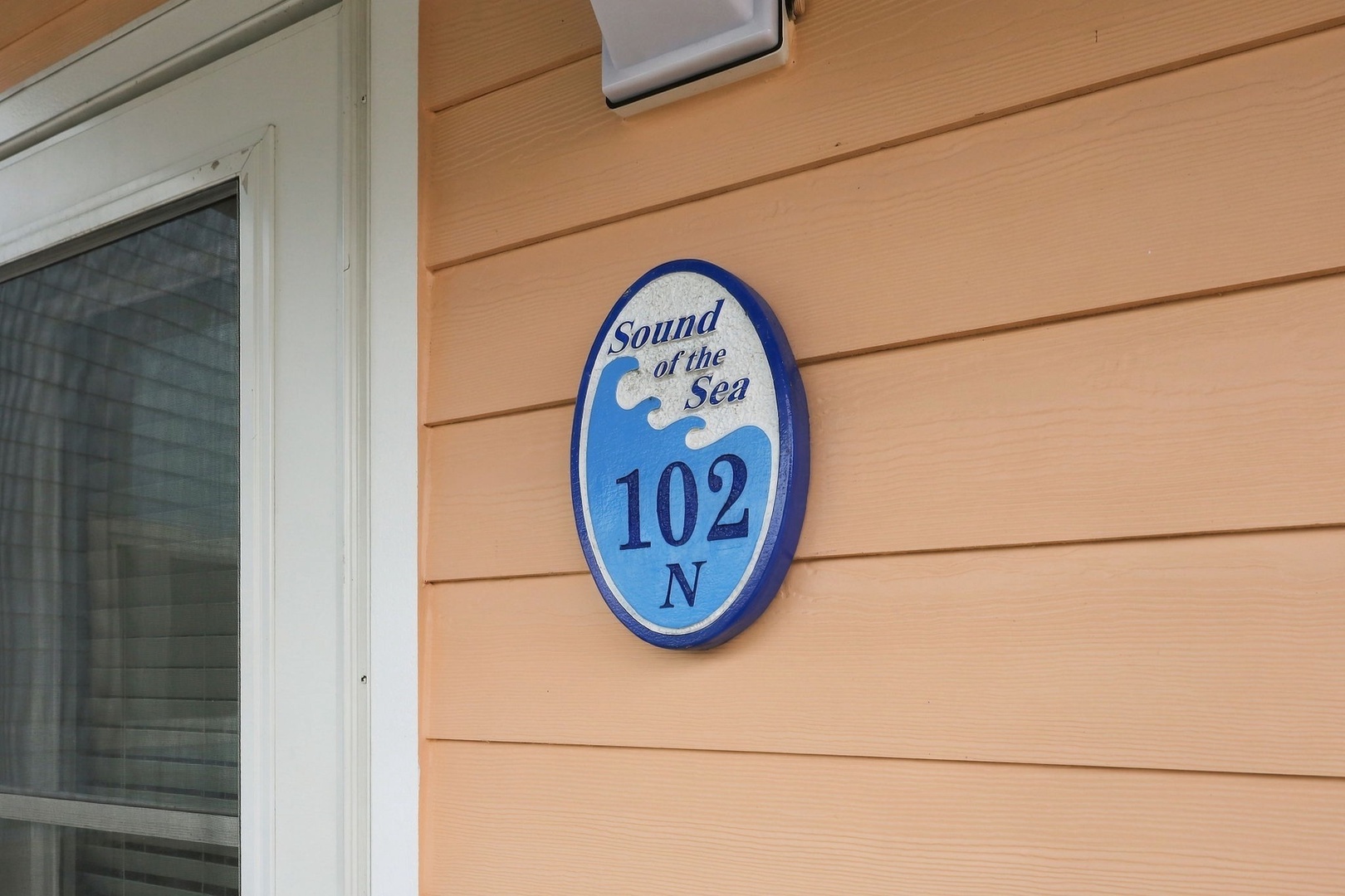 The property is located at Sound of the Sea, a charming coastal setting with easy access to nearby beaches and ocean activities.