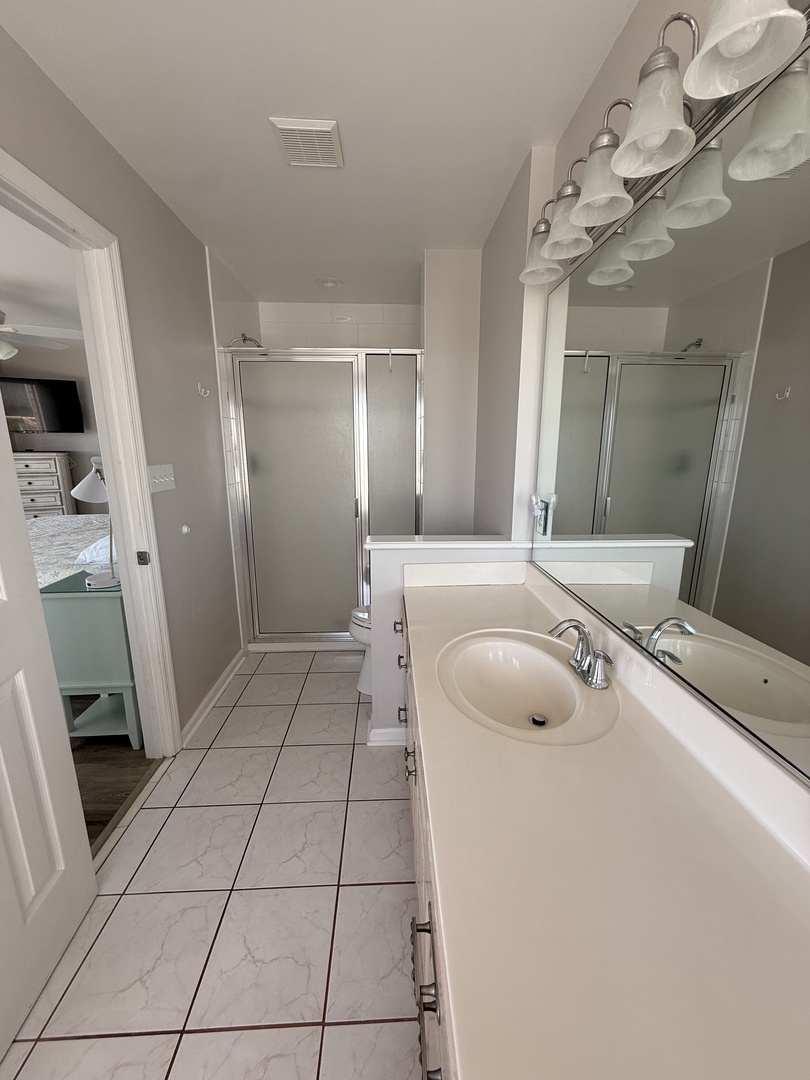Your private bathroom offers a sleek shower, fresh towels, and everything you need to refresh and recharge in bright, spotless comfort.