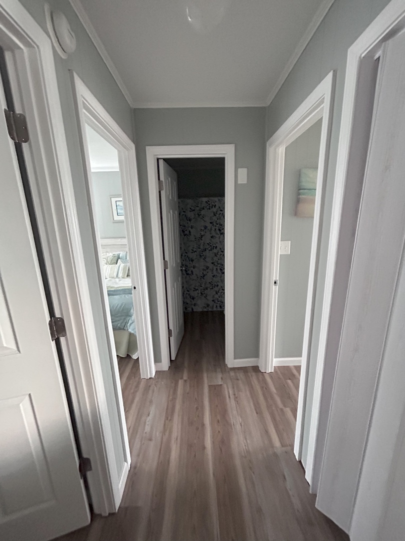 Your private hallway connects you to peaceful bedrooms and a stylish bathroom, creating the perfect flow through your home away from home.