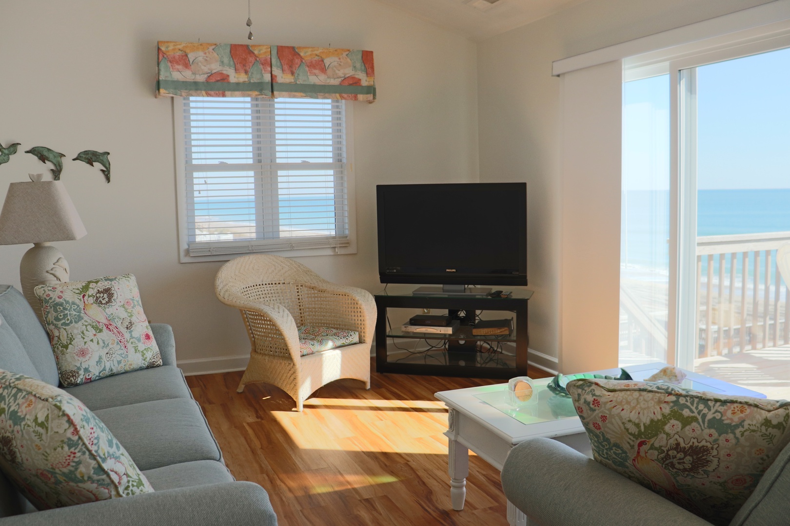 Your bright living room flows seamlessly to the ocean beyond, where morning coffee tastes better with waves as your backdrop.