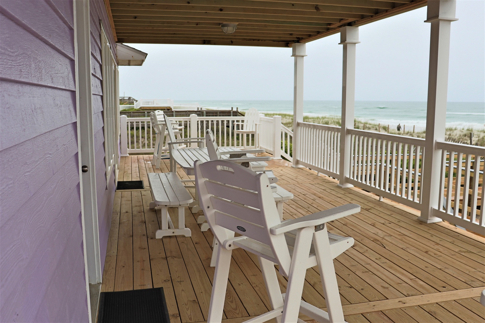 Unwind on your private oceanfront deck with comfortable seating and breathtaking sea views stretching to the horizon.