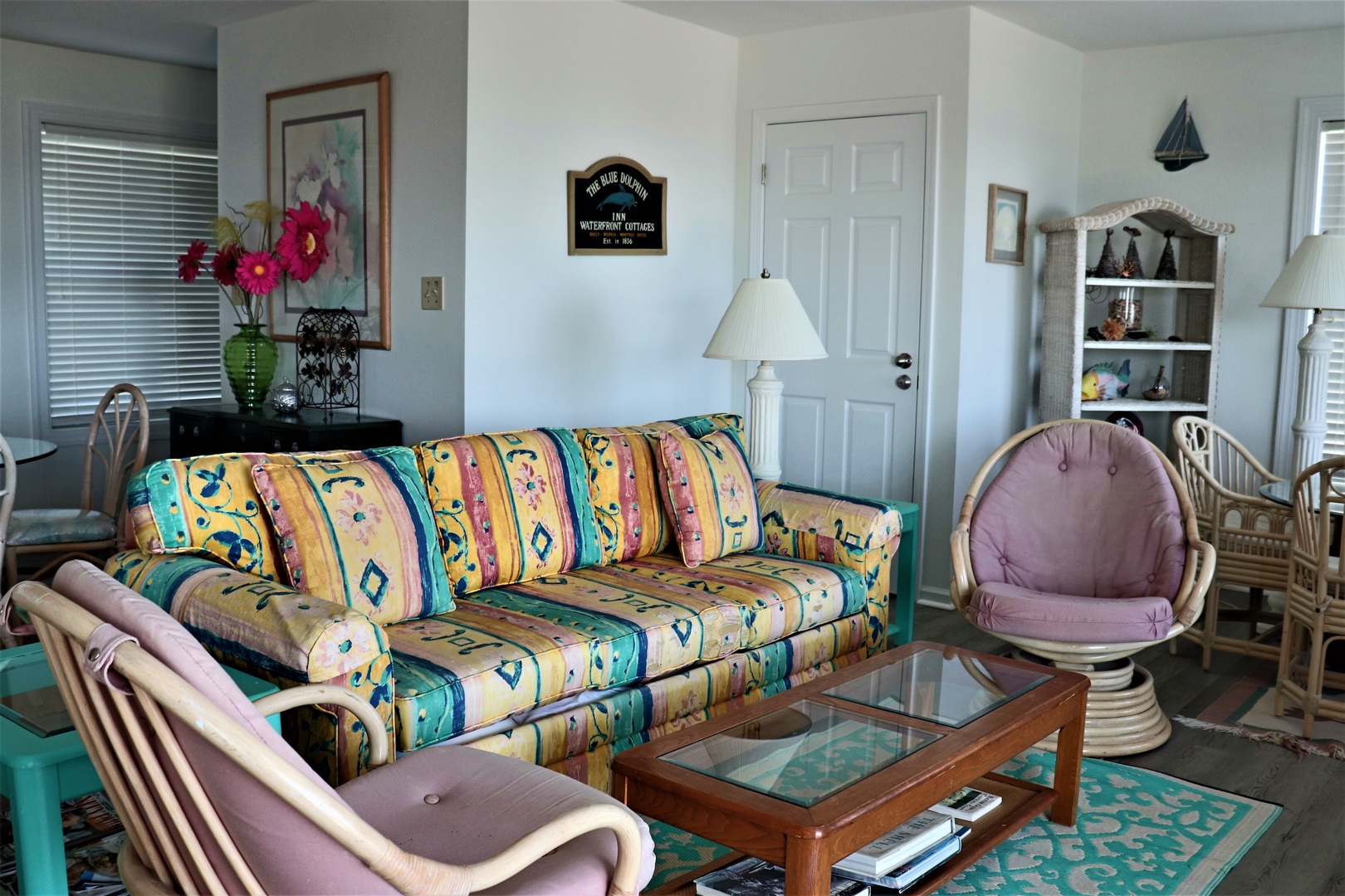 Relax in this charming coastal living room with vibrant furnishings, comfortable seating, and beach-themed touches that invite you to unwind.