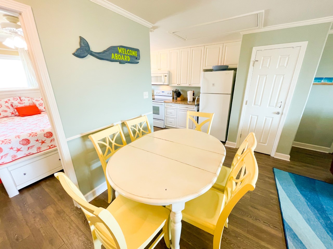 Gather around your bright dining table for meals and games, with a fully equipped kitchen just steps away for all your culinary adventures.