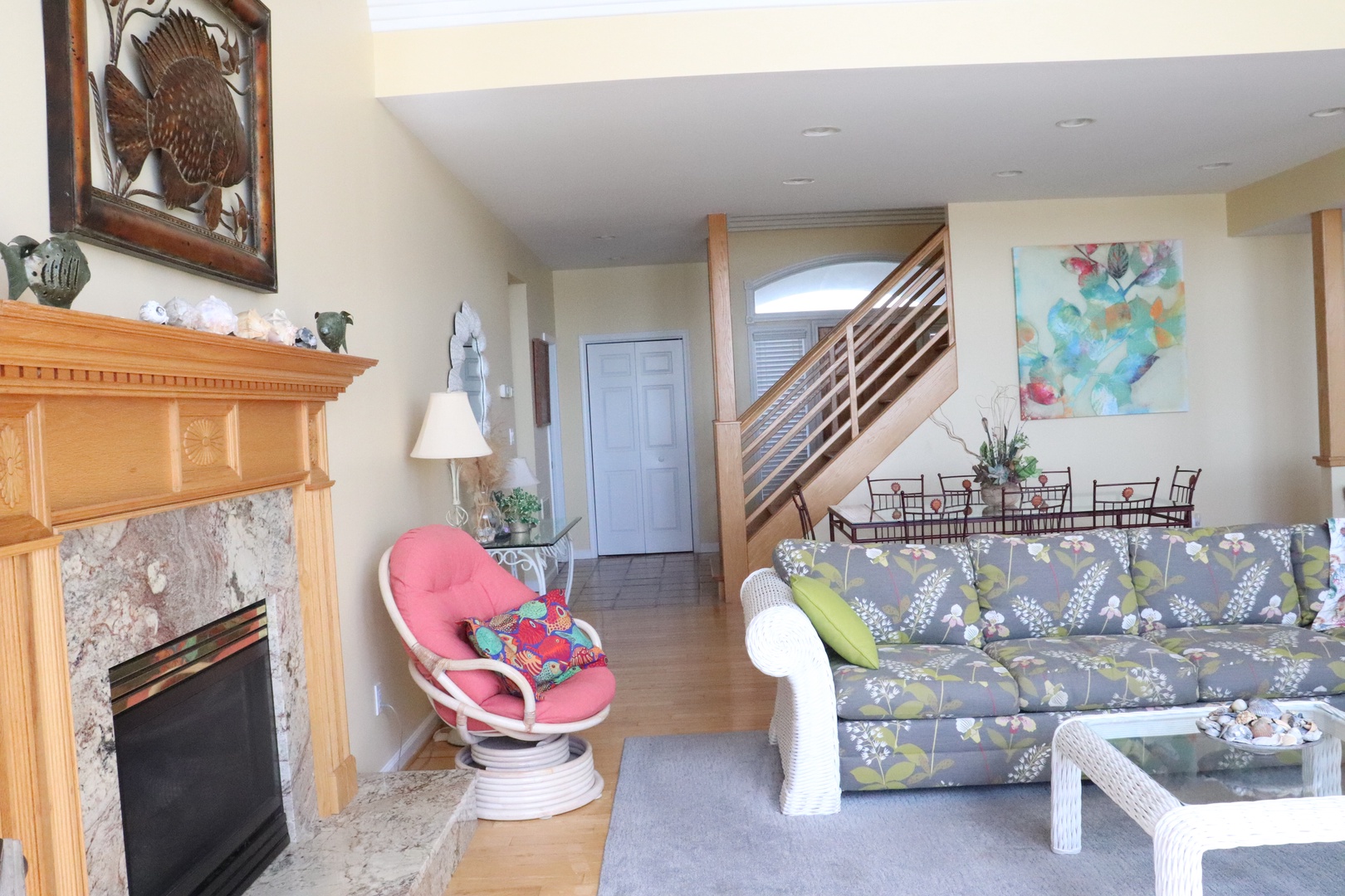 Unwind in your bright living space with cozy fireplace, comfortable seating, and artistic touches that make every moment feel like home.