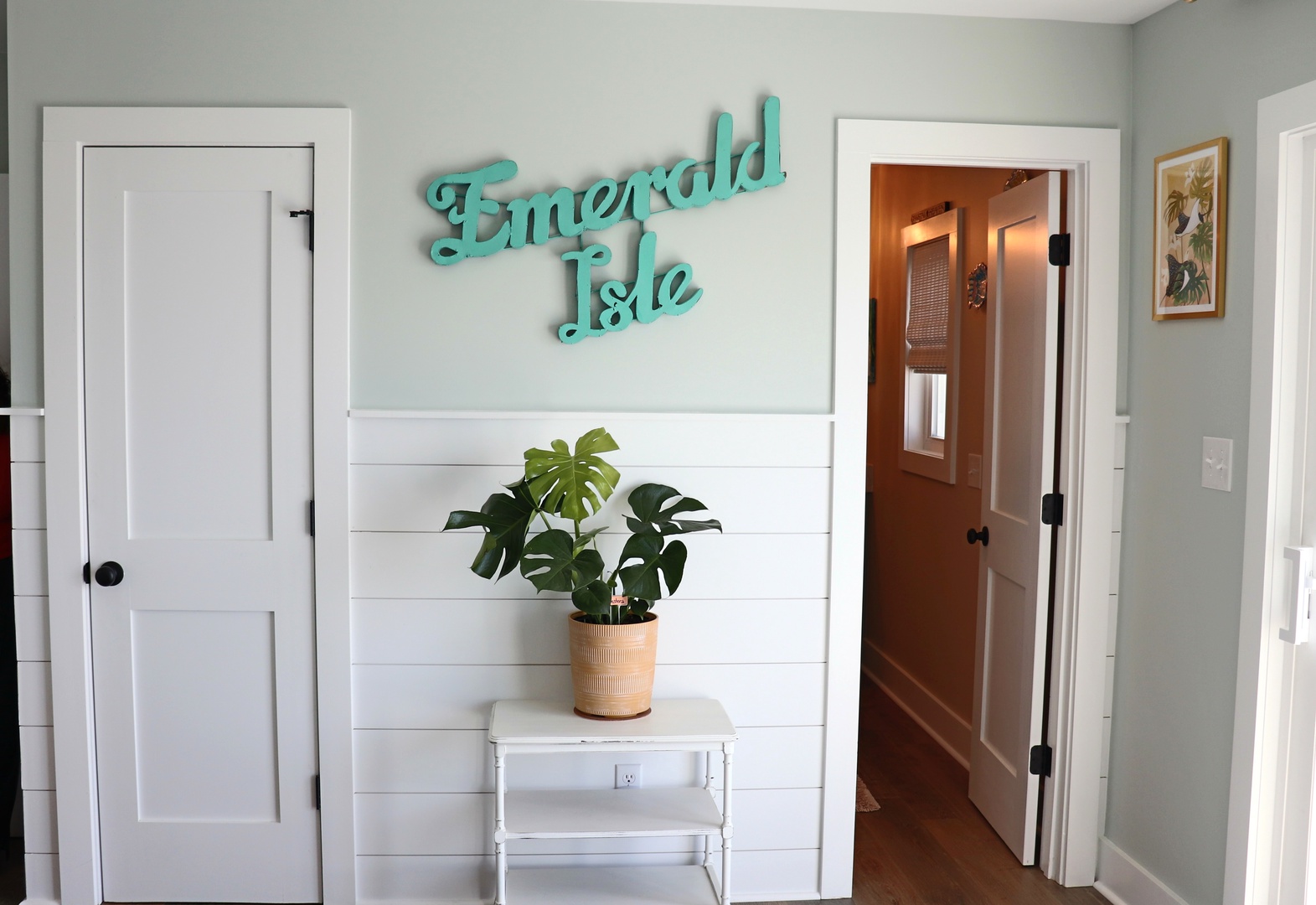 Step into your charming Emerald Isle retreat where coastal vibes meet modern comfort in this welcoming entryway.