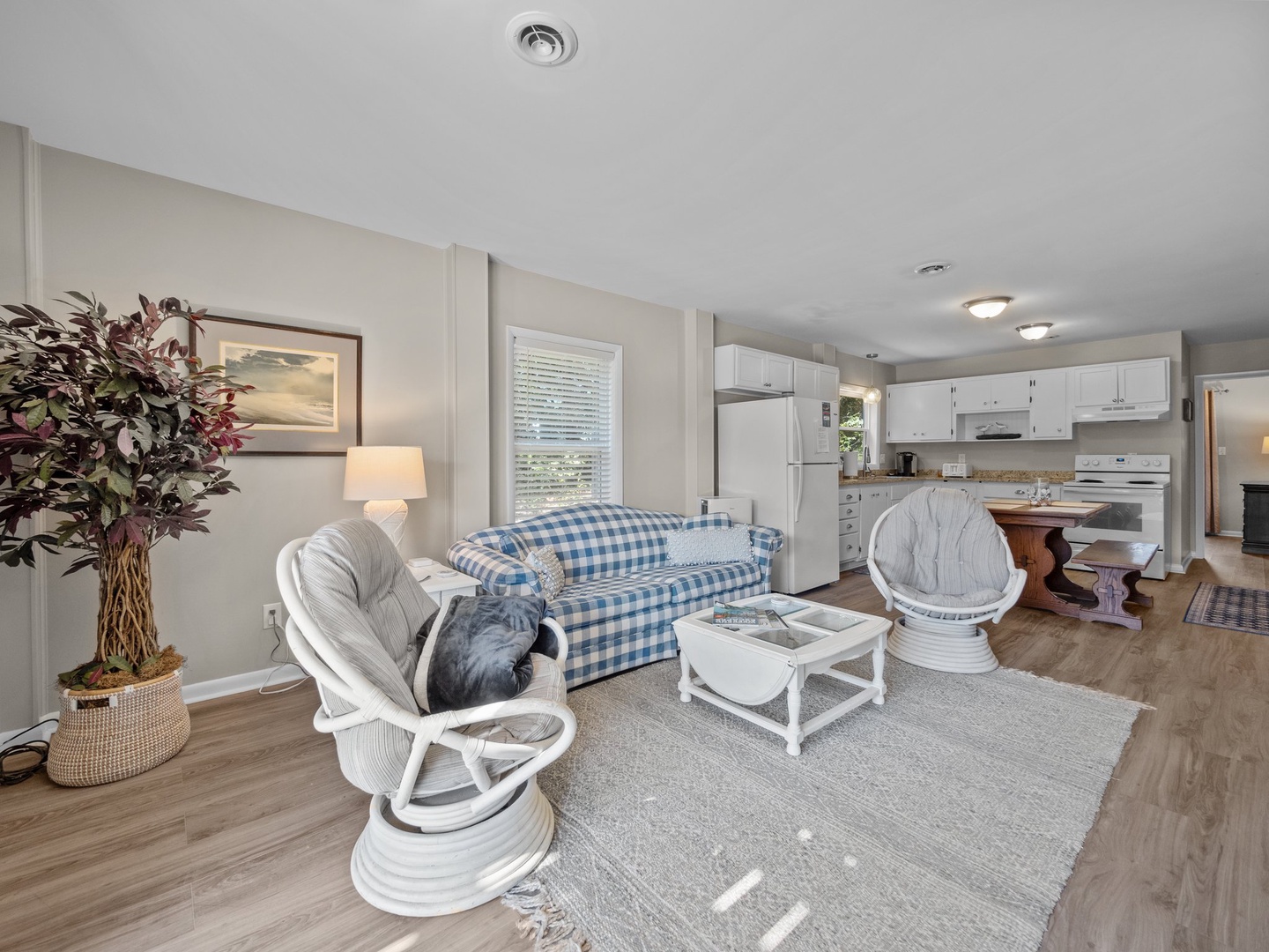 Unwind in your spacious living room with comfy seating and an open kitchen for easy meal prep.