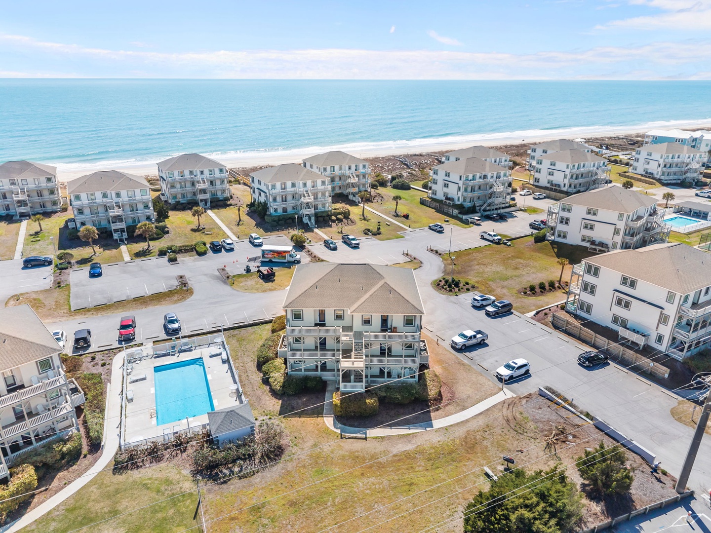 Stunning beachfront vacation rental community with oceanfront properties, private pools, and direct beach access along pristine coastline.