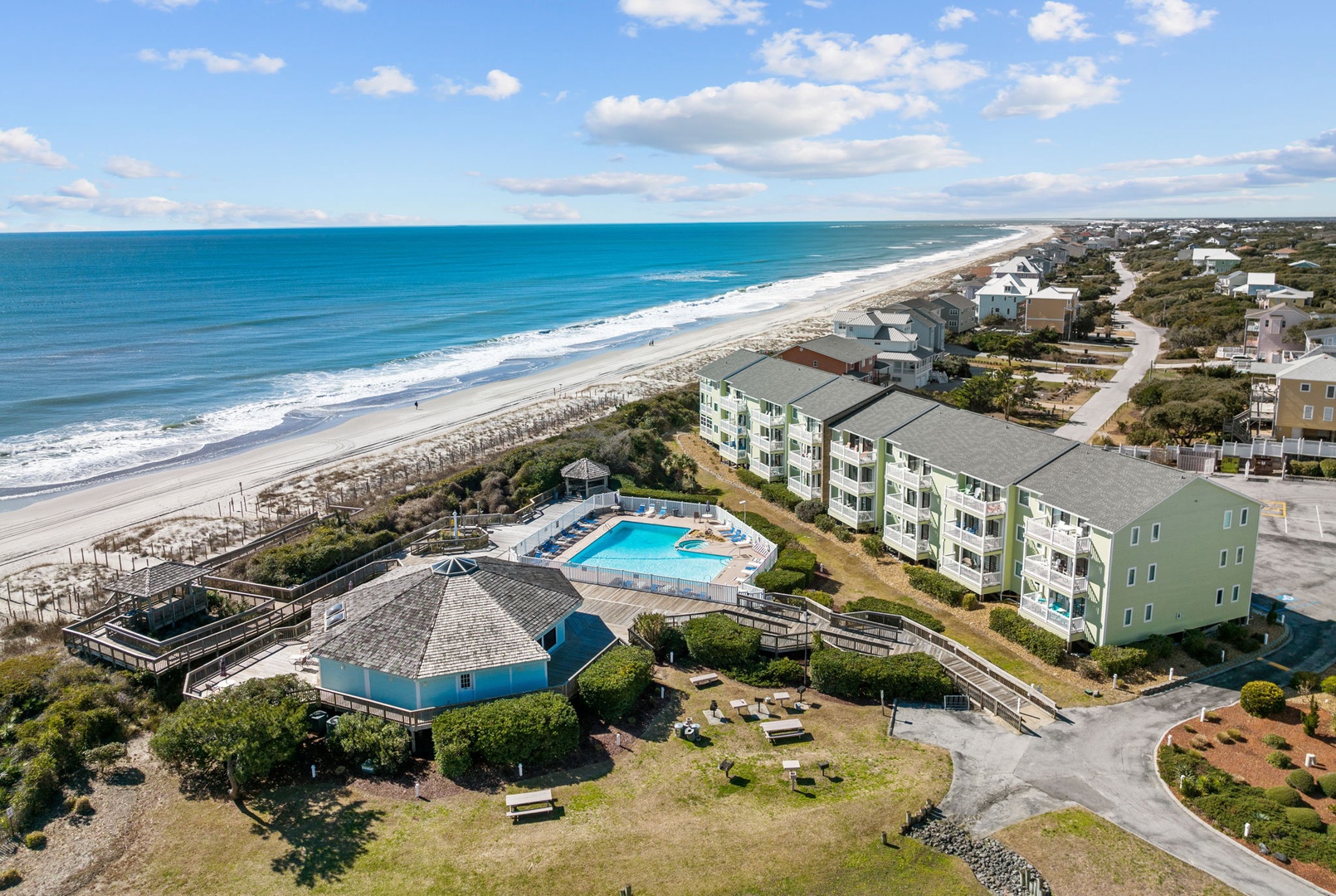 Oceanfront resort community featuring pristine beachfront access, sparkling pool, and contemporary accommodations just steps from the shore.
