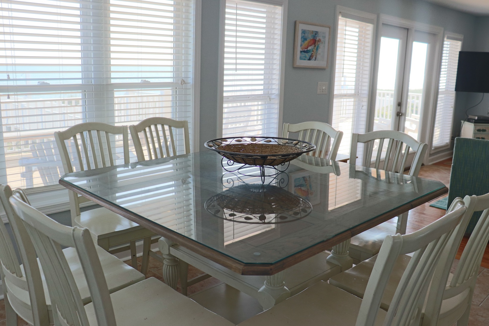 Gather your group around this spacious glass dining table, where morning coffee and evening meals become cherished vacation memories.