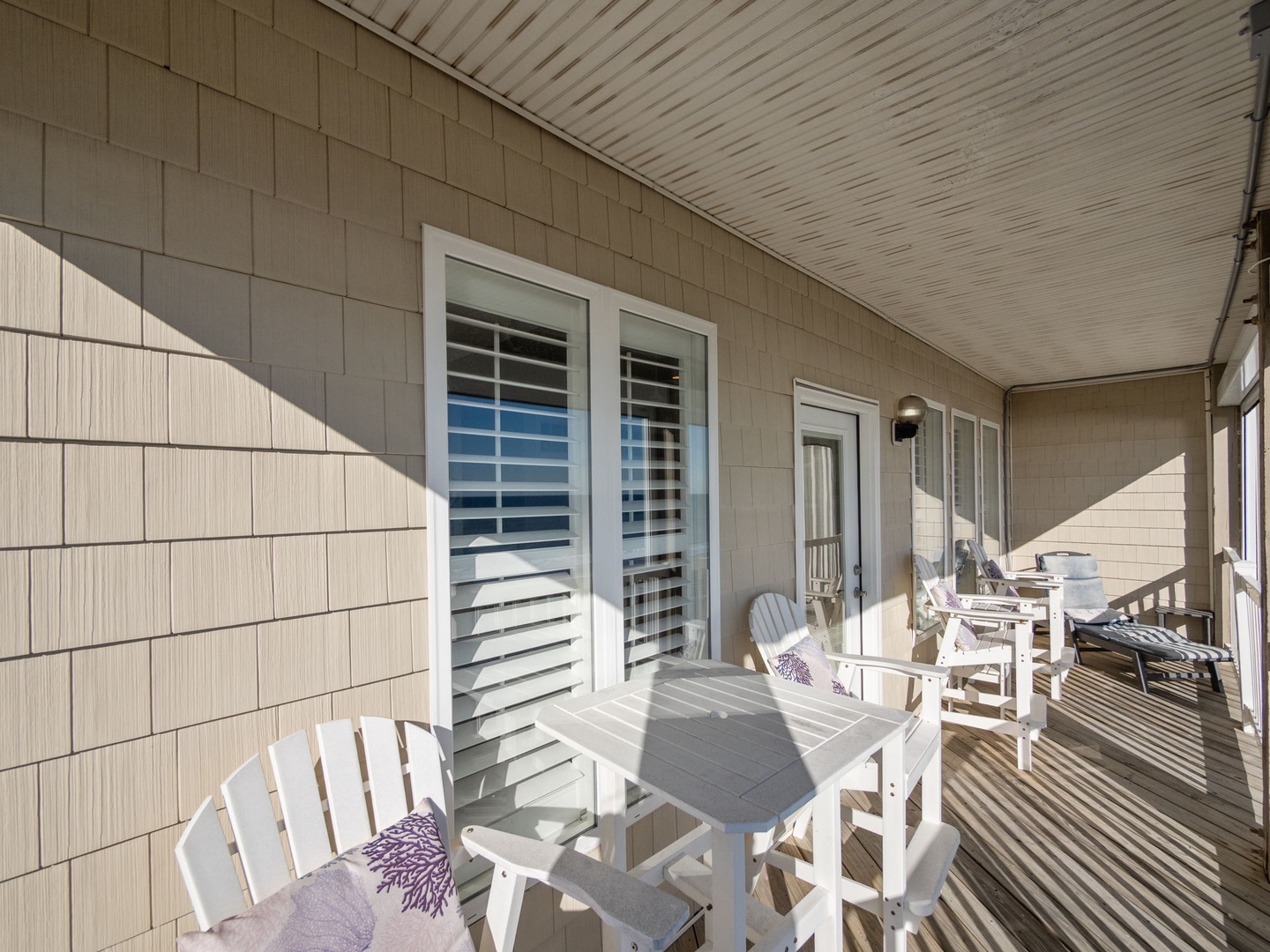 Step onto your private balcony where morning coffee tastes better with coastal breezes and afternoon lounging feels effortless in comfortable chairs.