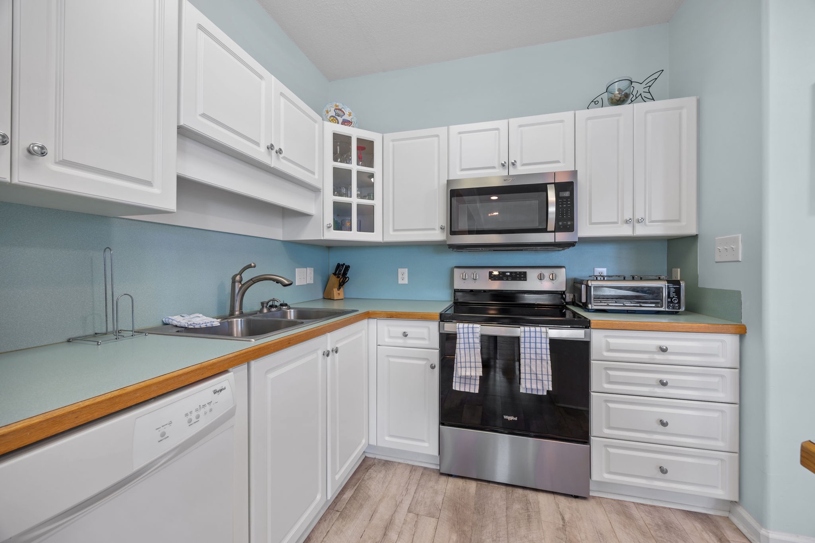 Your fully-equipped kitchen features modern appliances and plenty of counter space for preparing delicious meals during your stay.