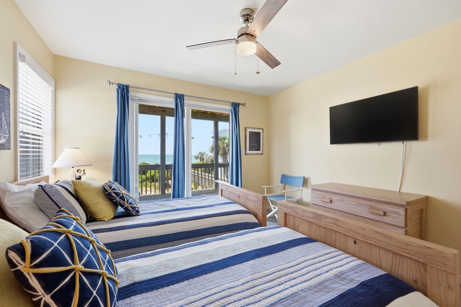 Wake up to stunning ocean views from your coastal bedroom, styled with nautical charm and a private balcony to enjoy the sea breeze.