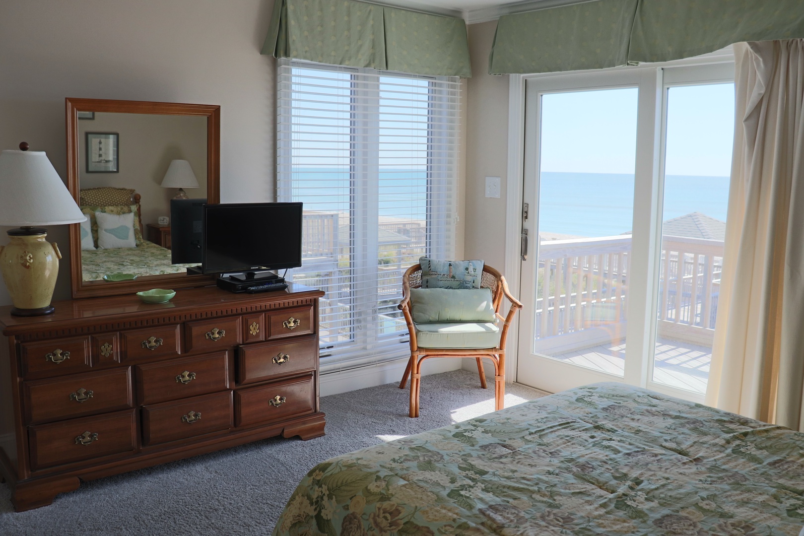 Wake up to stunning ocean views from your comfortable bedroom, where classic furnishings meet modern amenities for the perfect coastal retreat.