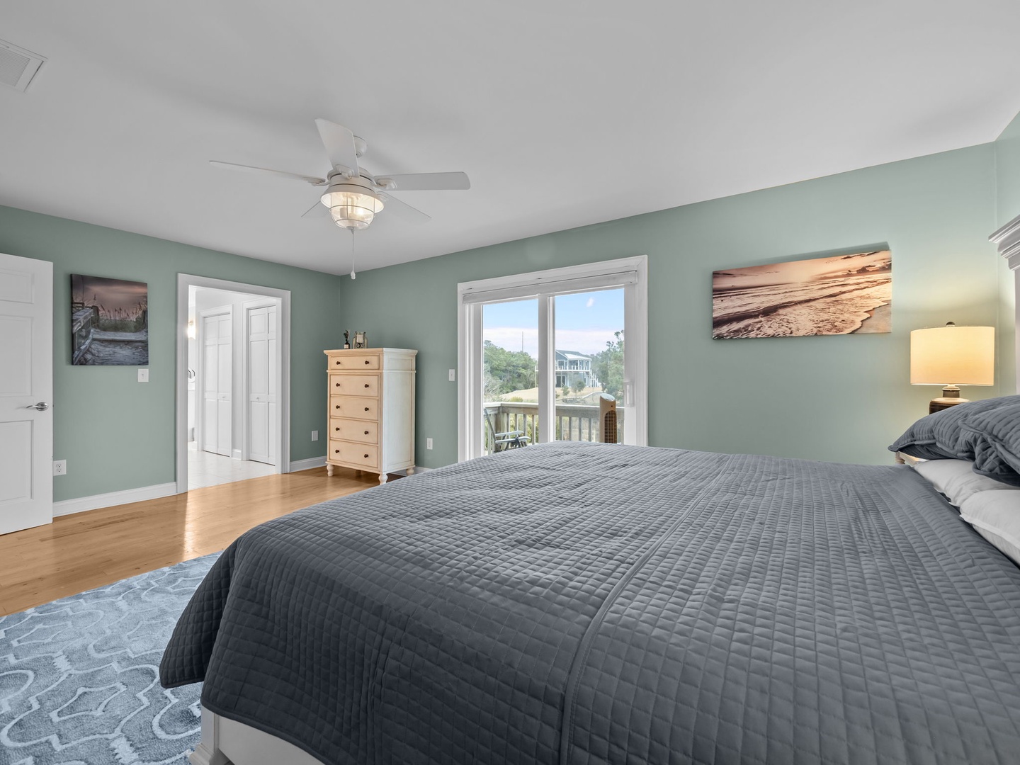 Your serene bedroom features calming sage walls, plush bedding, and a balcony view where you can wake up to peaceful mornings.