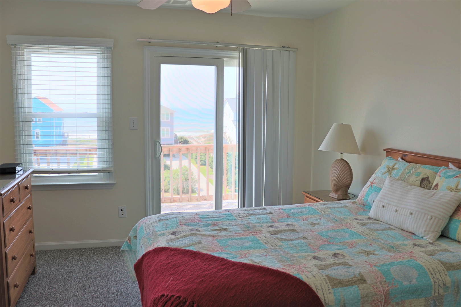 Wake up to ocean views from your comfortable bedroom, where coastal charm meets modern comfort and sliding doors open to fresh sea breezes.