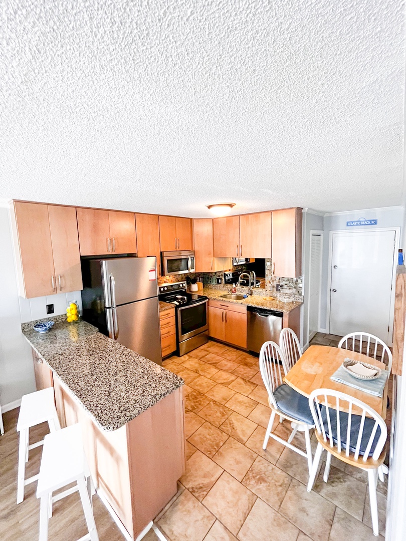 Your fully equipped kitchen features granite countertops, stainless steel appliances, and a cozy breakfast nook for memorable meal times.