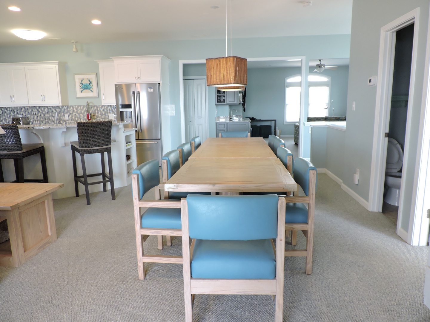 Your spacious dining area flows seamlessly into the modern kitchen, where you can gather for memorable meals together.