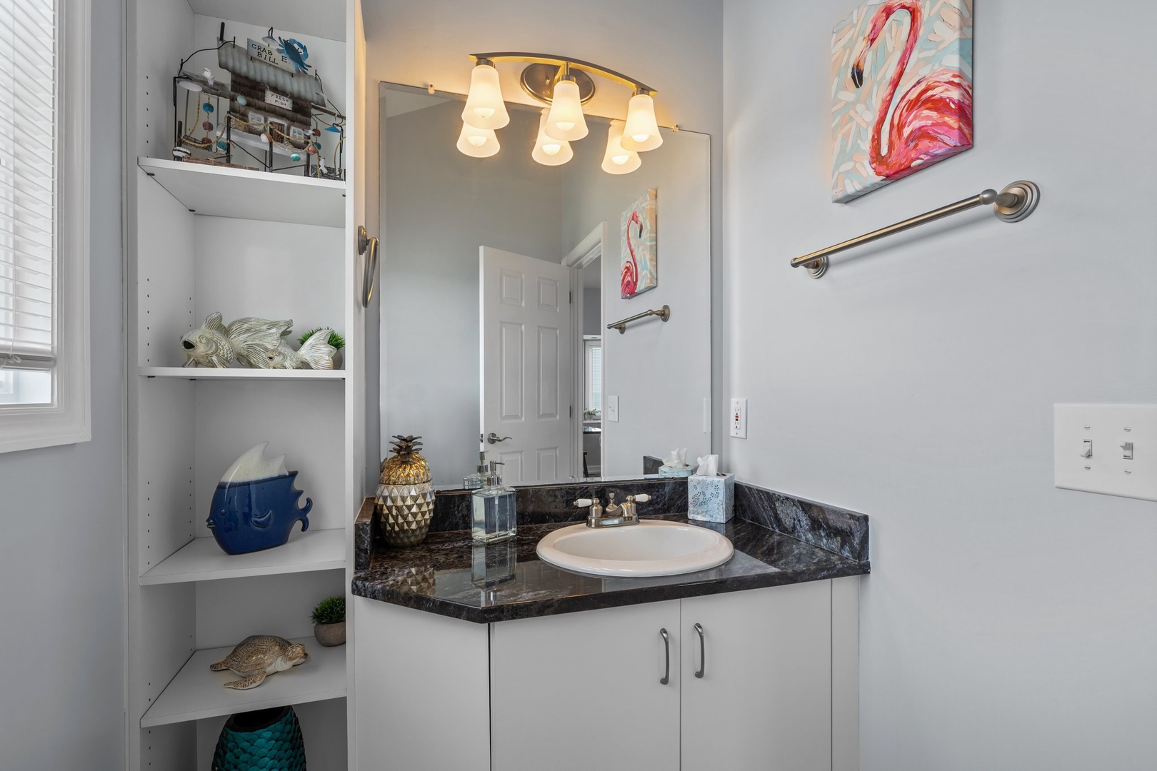 Your private bathroom features granite counters, tropical touches, and convenient storage for all your essentials.