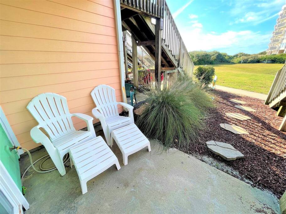 Unwind in your private patio chairs while enjoying peaceful field views and thoughtfully landscaped grounds.
