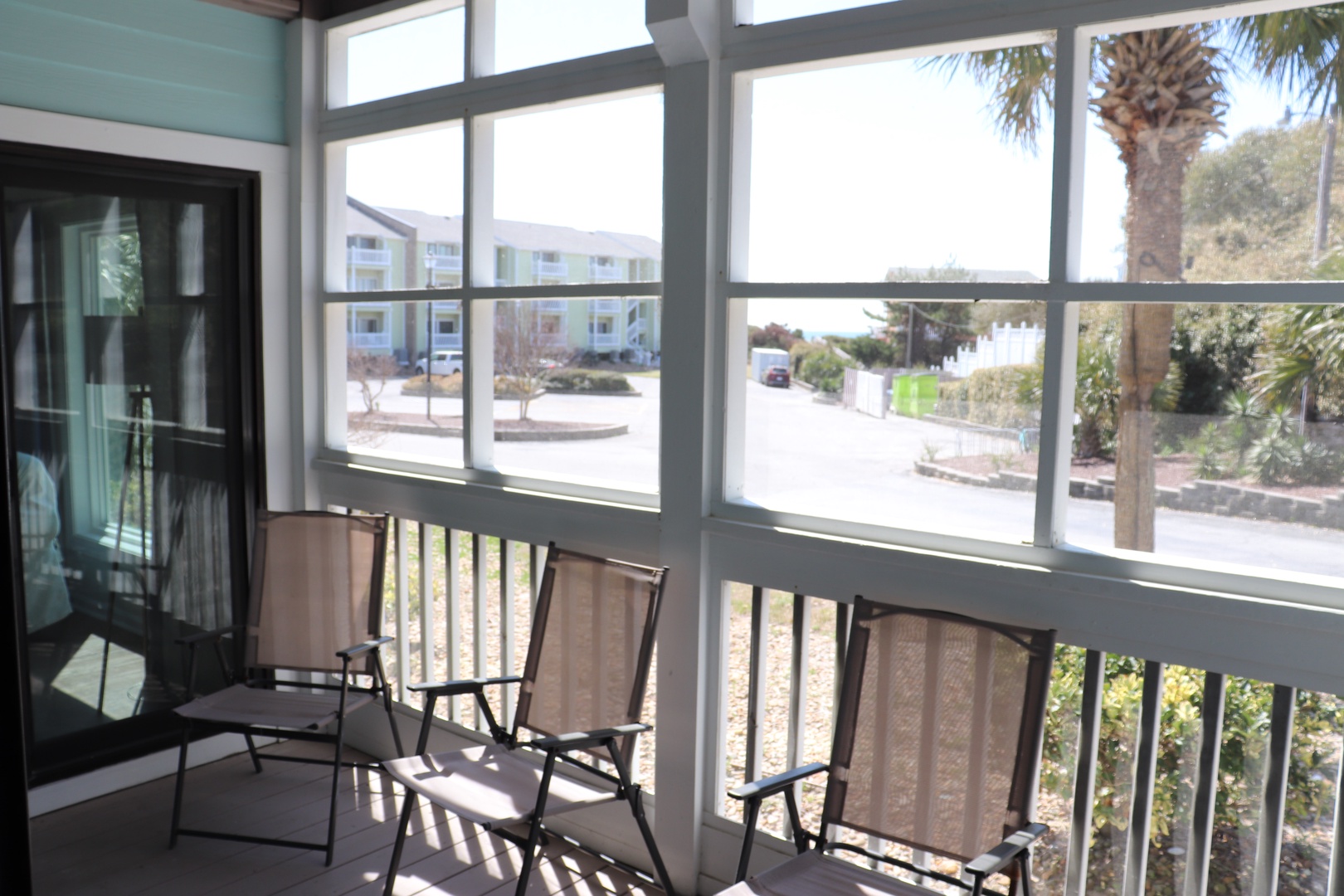Your private screened porch offers comfortable seating where you can relax while enjoying views of the tropical neighborhood.