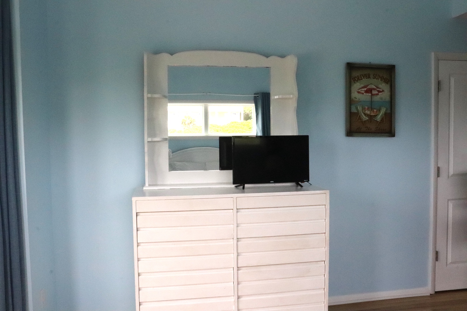 Your dresser includes plenty of storage for unpacking and settling in. Watch your favorite shows on the flat-screen TV while you relax in the comfort of your room.