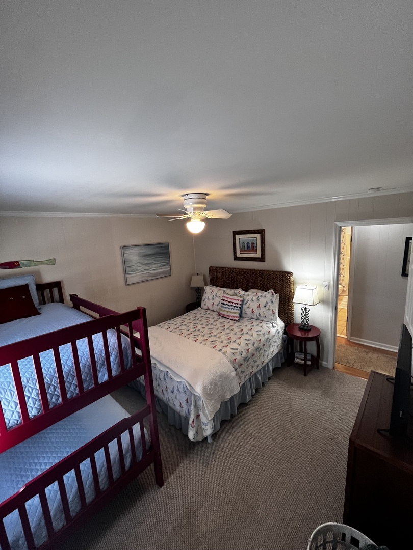 Your cozy bedroom features comfortable beds and warm lighting, creating the perfect retreat after exploring the area.