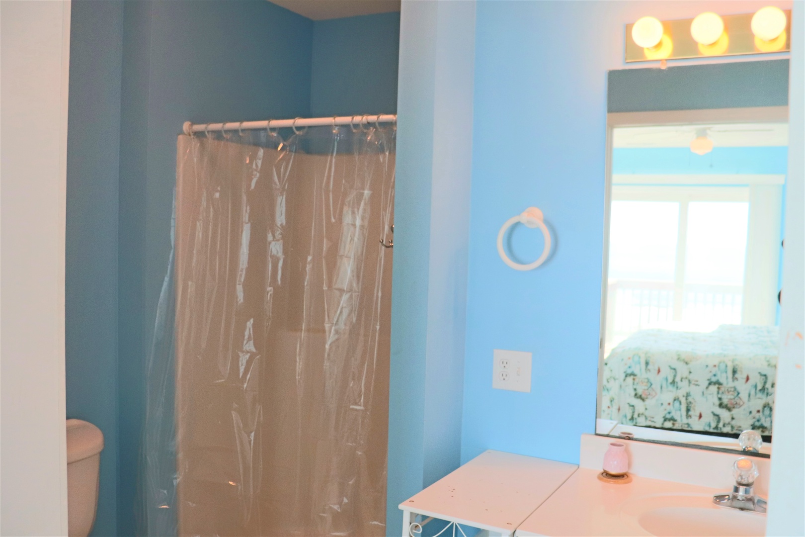 Refresh in your bright, cheerful bathroom with convenient shower and vanity space.