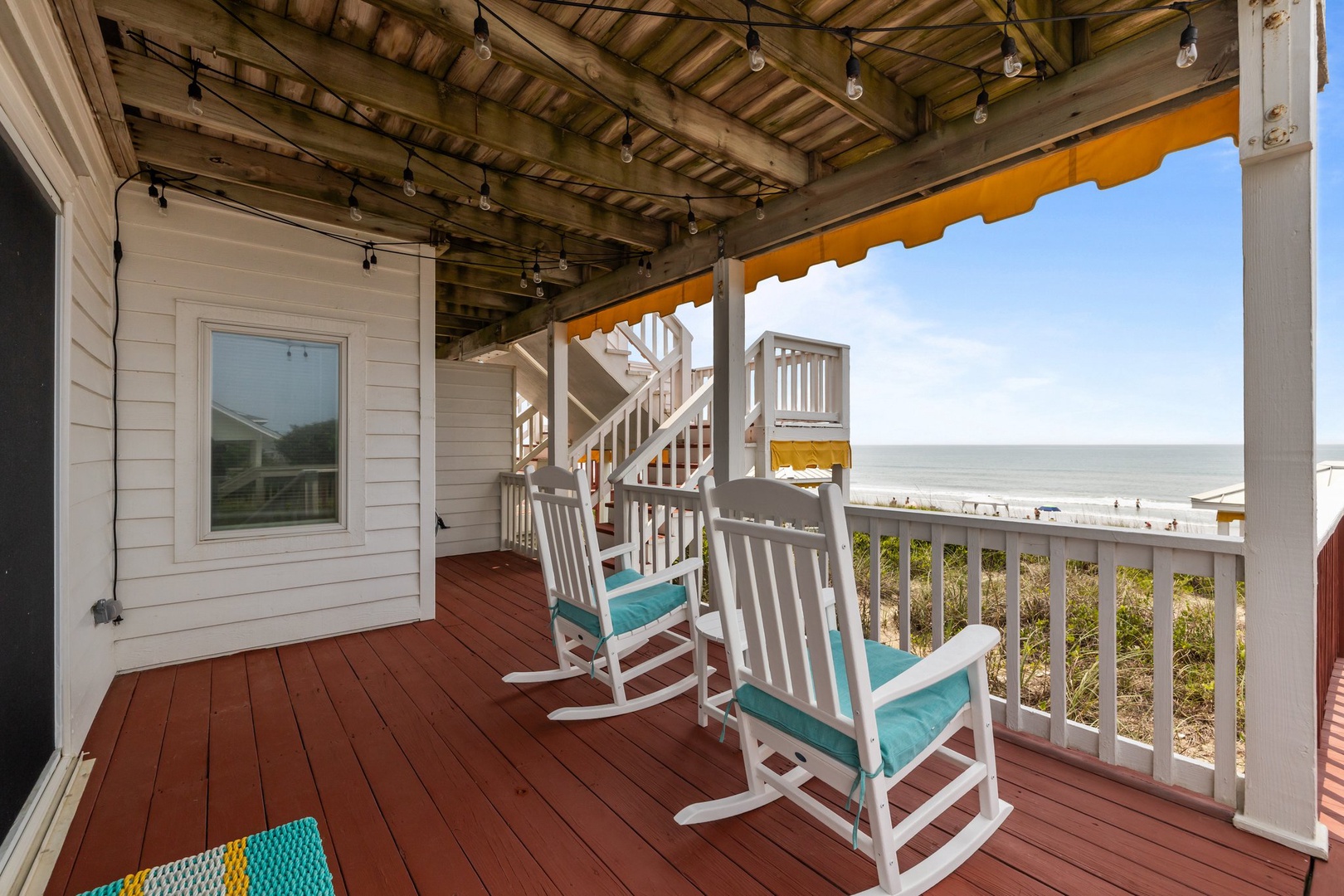 Unwind on your private deck with rocking chairs and stunning ocean views.