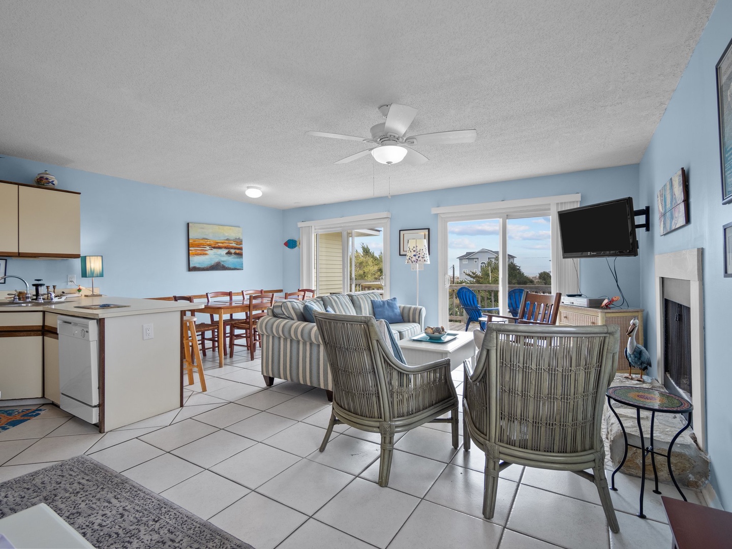 Relax in this bright, coastal living space where ocean breezes flow through your open-concept retreat, complete with full kitchen and fireplace.
