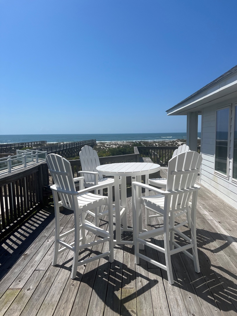 Sip your morning coffee at this elevated oceanfront deck with sweeping sea views and comfortable seating for memorable coastal moments.