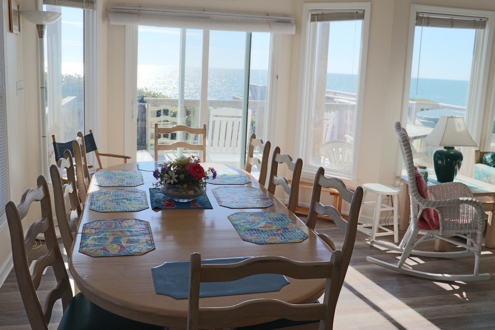 Gather around your beautiful dining table while soaking in breathtaking ocean views through floor-to-ceiling windows.