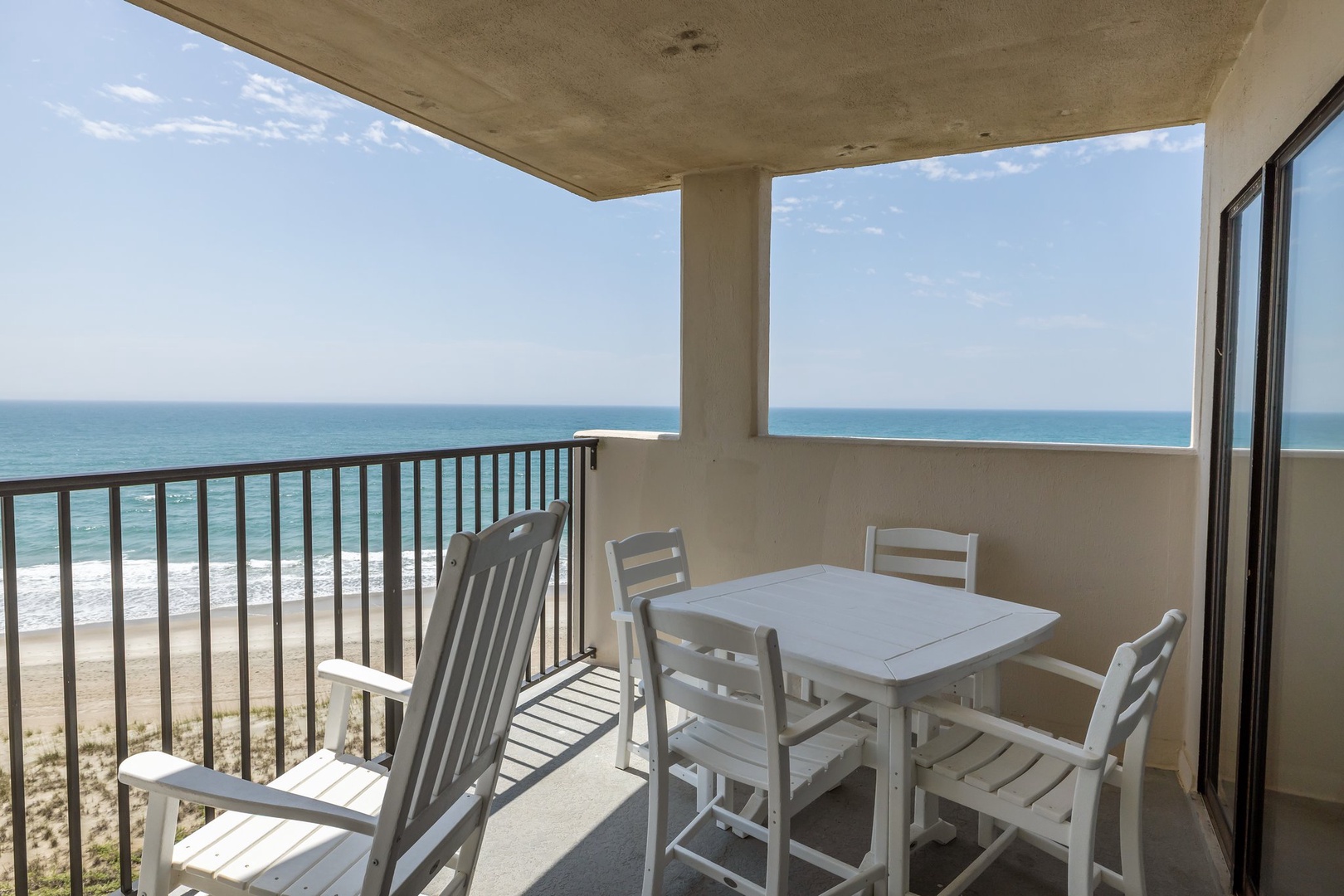 Your private oceanfront balcony features dining for six with breathtaking sea views. Watch waves crash below while enjoying meals in this peaceful coastal retreat.