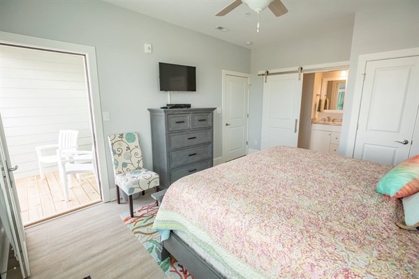 Drift off in your bright, airy bedroom with ocean access and thoughtful touches like a cozy reading chair and barn door bathroom.