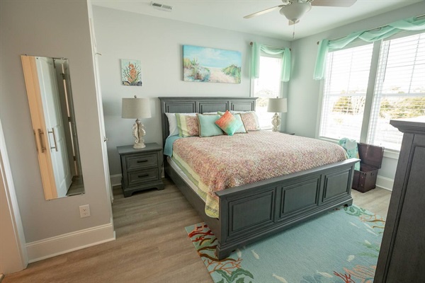 Your peaceful bedroom retreat features coastal colors and comfortable furnishings perfect for restful nights by the sea.